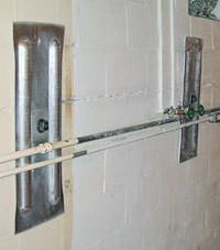 A foundation wall anchor system used to repair a basement wall in Exeter