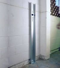 A failing foundation wall repaired with a foundation wall channel anchor system in a St Thomas home.