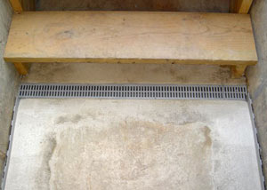 Our grated drain system installed on a leaking basement staircase in Port Stanley.