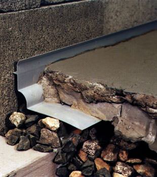 a custom designed basement drain system for thin basement floors in Mount Forest.