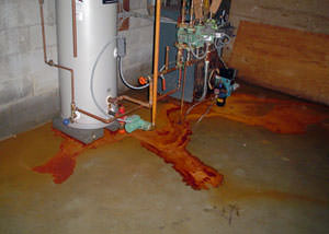 Iron ochre laden water on a concrete basement floor, staining everything in this Mount Forest home.