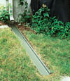 A recessed gutter drain extension installed in Lambton Shores, Ontario