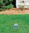 A buried gutter drain downspout extension installed in a Lambton Shores home