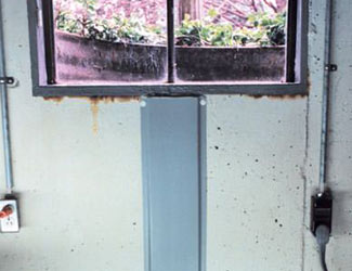 Repaired waterproofed basement window leak in St Thomas