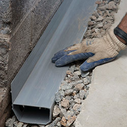 installing a drain tile system in a Exeter home
